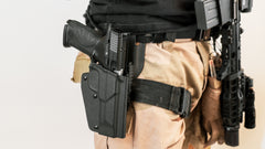 Holster dropleg adapter, QLS Fork set, and thigh strap pictured here with an M&P9 holster